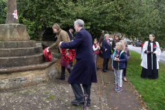 Laying poppy wreaths