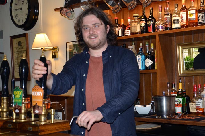 Aidan behind the bar