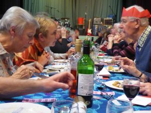 Members eating Christmas dinner