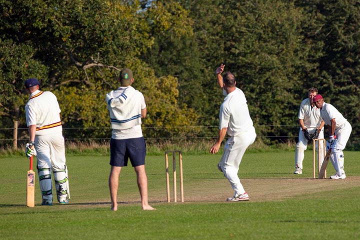 Peter Higgins manages to get his arm over against Blenheim Palace with Phil Chesser ready to take any catch